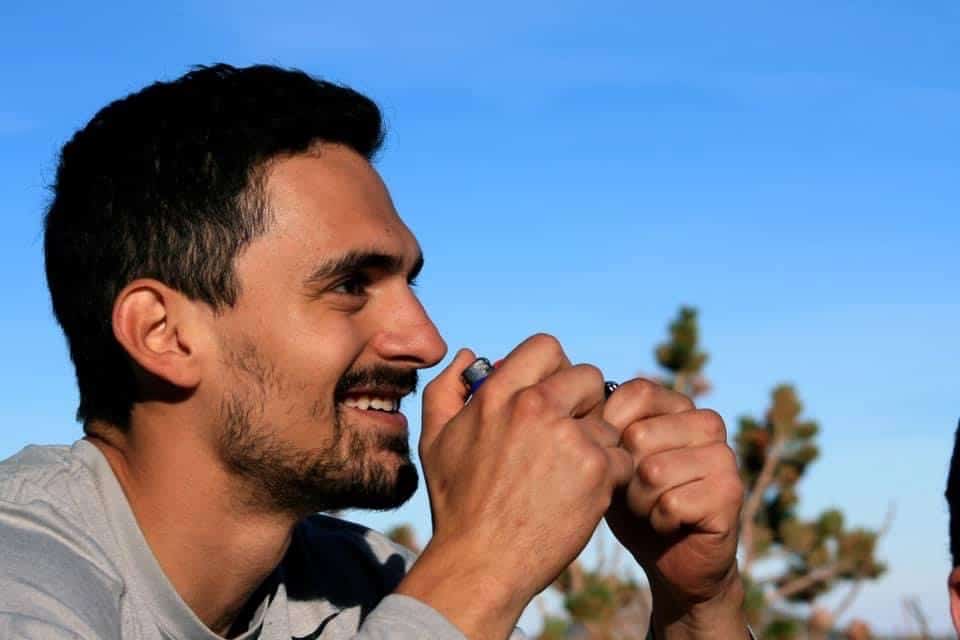 Nicholas Anthony Moses smiling outdoors
